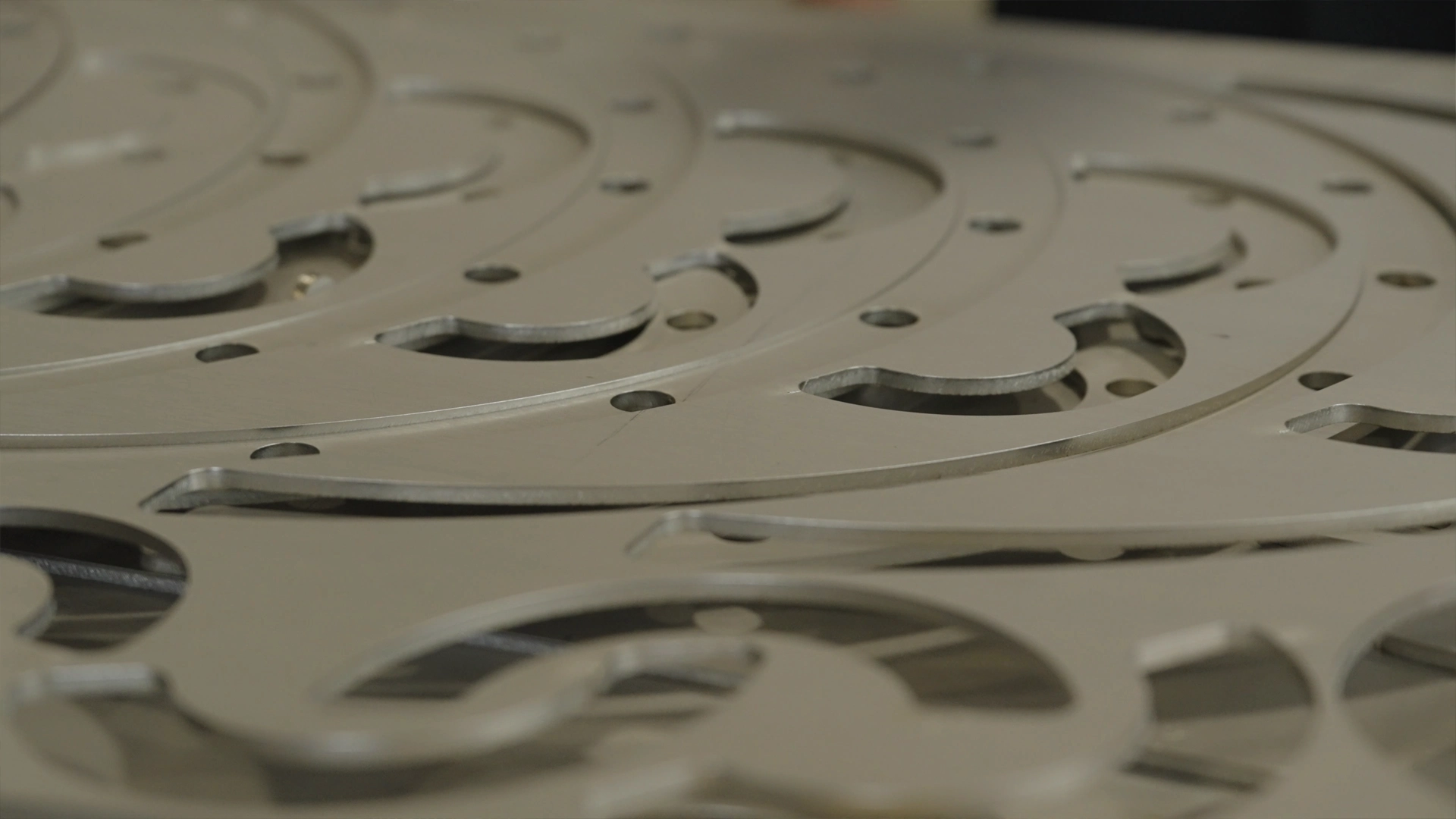 stack of precision fiber laser cut metal parts
